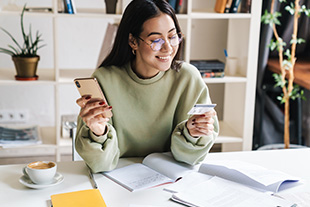 Woman in Vancouver WA area charges her first credit card following successful credit card application