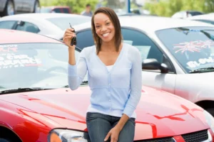 Peoples Credit Union member purchasing a used car in a car lot